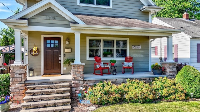 1315 W Jackson St, Ottawa, IL 61350 - property entrance with a porch and roof with shingles