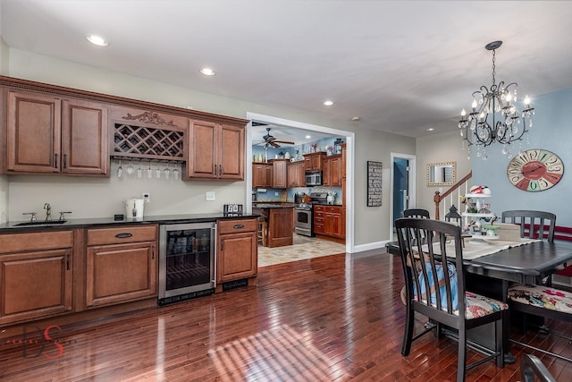 1315 W Jackson St, Ottawa, IL 61350 - kitchen with stainless steel appliances, beverage cooler, dark countertops, dark wood finished floors, and a chandelier