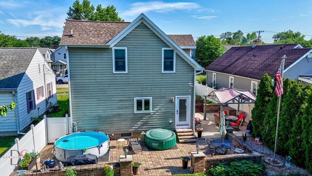 1315 W Jackson St, Ottawa, IL 61350 - back of house featuring a patio area, an outdoor fire pit, a fenced backyard, and roof with shingles