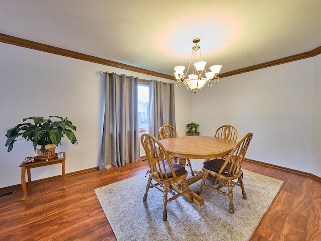 7201 W 110th St, Worth, IL 60482 - dining space with ornamental molding, a chandelier, and wood finished floors