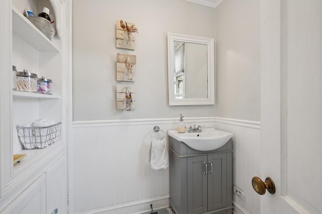32 Valley Rd, Highland Park, IL 60035 - bathroom with vanity, a wainscoted wall, and ornamental molding