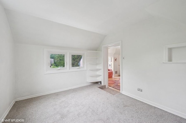 32 Valley Rd, Highland Park, IL 60035 - unfurnished bedroom with lofted ceiling and carpet floors