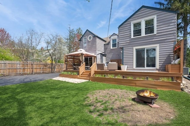 32 Valley Rd, Highland Park, IL 60035 - back of house with a gazebo, a fire pit, and a deck