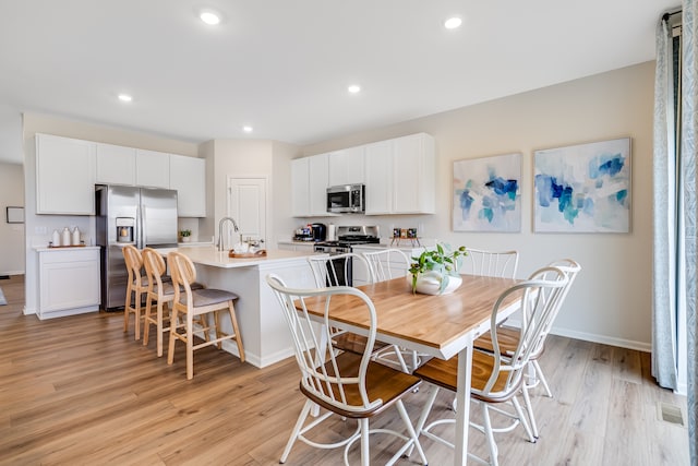 1039 Greenleaf St, Sycamore, IL 60178 - dining area featuring light wood-type flooring and recessed lighting