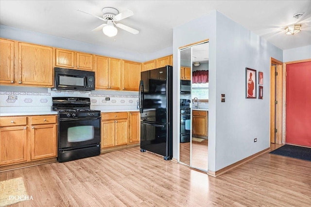 2006 Westmore Grove Dr, Plainfield, IL 60586 - kitchen with black appliances, light countertops, a ceiling fan, and backsplash