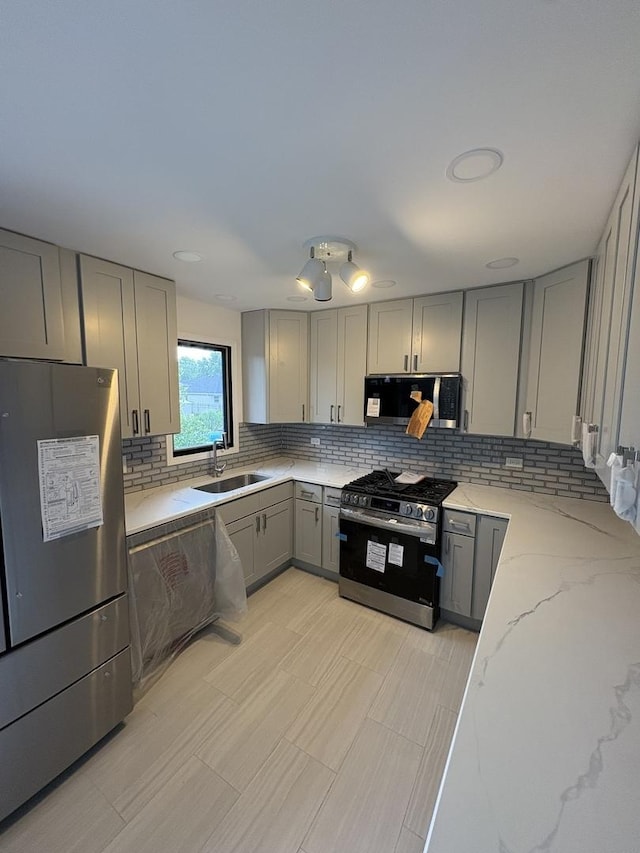 13623 S 84th Ave, Orland Park, IL 60462 - kitchen with appliances with stainless steel finishes, gray cabinetry, decorative backsplash, and light stone counters