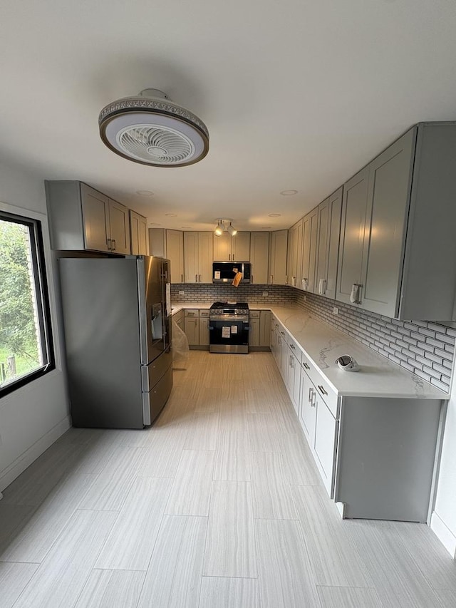 13623 S 84th Ave, Orland Park, IL 60462 - kitchen with stainless steel appliances, gray cabinets, tasteful backsplash, and light countertops