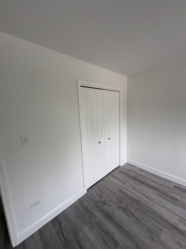 13623 S 84th Ave, Orland Park, IL 60462 - unfurnished bedroom with dark wood-type flooring and a closet