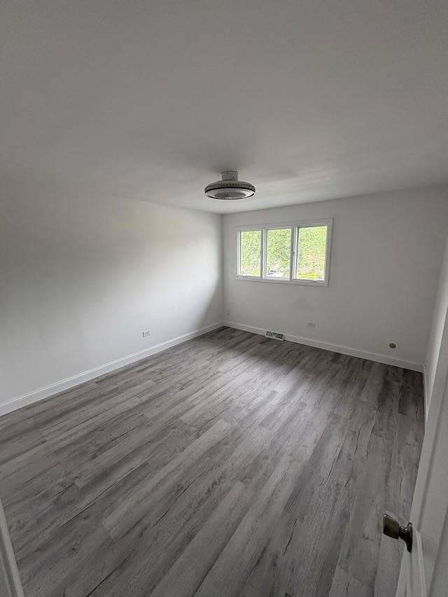 13623 S 84th Ave, Orland Park, IL 60462 - spare room featuring dark wood-type flooring and baseboards