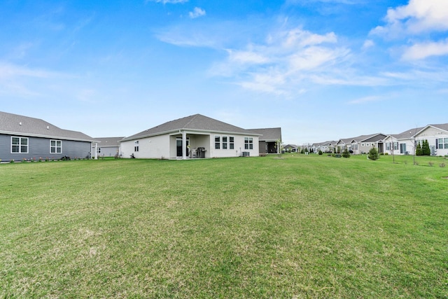 1664 Windsor Rd, Pingree Grove, IL 60140 - rear view of house with a lawn and a residential view