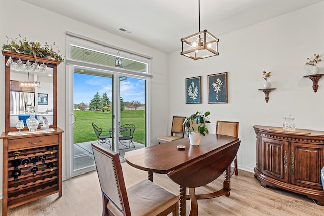 1664 Windsor Rd, Pingree Grove, IL 60140 - dining room featuring a chandelier and light wood finished floors