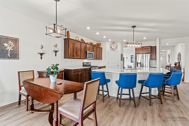 1664 Windsor Rd, Pingree Grove, IL 60140 - dining area featuring light wood-type flooring, a chandelier, and recessed lighting