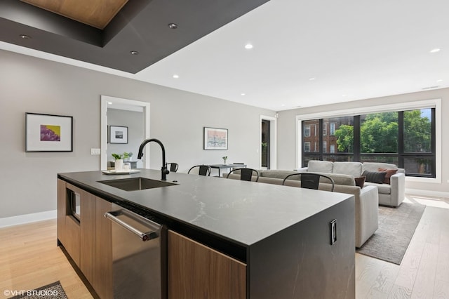 1523 N Western Ave Unit 2A, Chicago, IL 60622 - kitchen featuring stainless steel dishwasher, an island with sink, modern cabinets, light wood-style floors, and recessed lighting