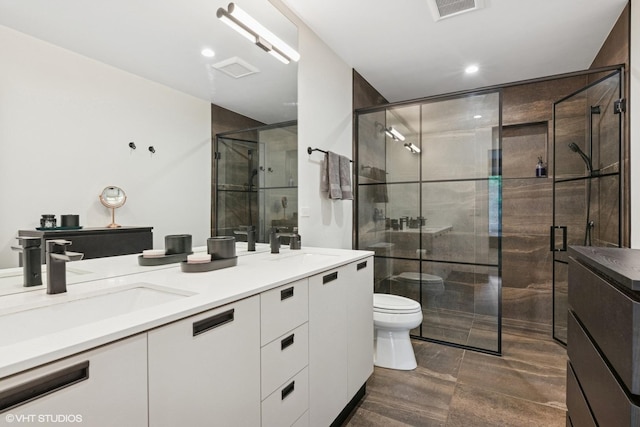 1523 N Western Ave Unit 2A, Chicago, IL 60622 - bathroom with double vanity, a stall shower, and recessed lighting