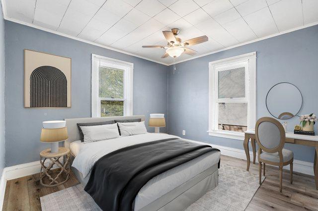434 4th Ave, Joliet, IL 60433 - bedroom with ornamental molding, wood finished floors, and ceiling fan