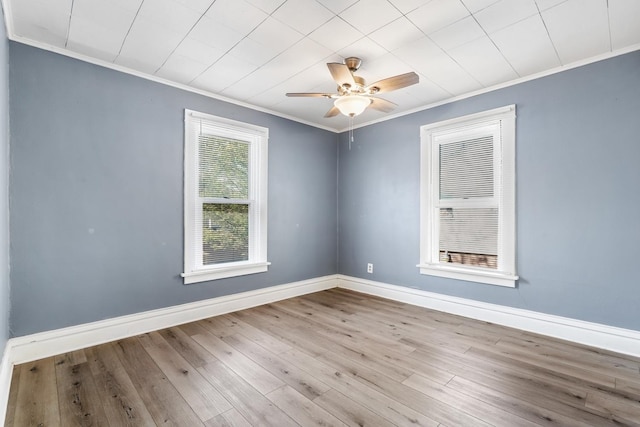 434 4th Ave, Joliet, IL 60433 - spare room with crown molding, wood finished floors, and a ceiling fan