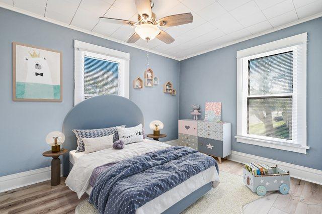 434 4th Ave, Joliet, IL 60433 - bedroom with ornamental molding, multiple windows, wood finished floors, and a ceiling fan