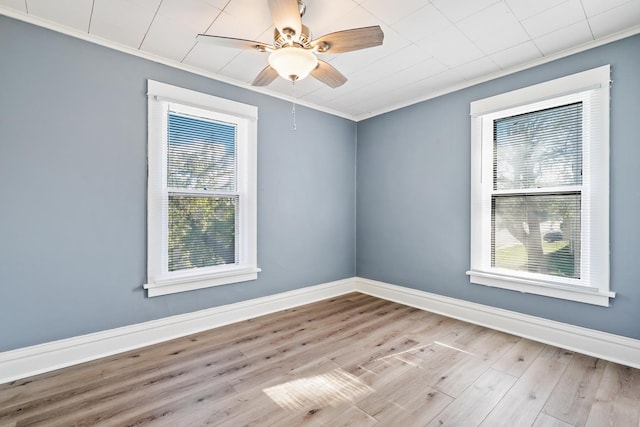 434 4th Ave, Joliet, IL 60433 - spare room with ornamental molding, wood finished floors, and a ceiling fan