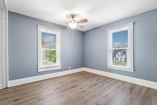 434 4th Ave, Joliet, IL 60433 - empty room featuring healthy amount of natural light, wood finished floors, and ceiling fan