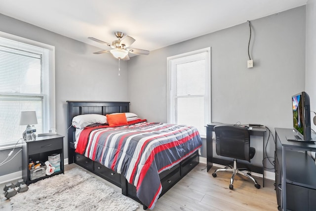 434 4th Ave, Joliet, IL 60433 - bedroom with wood finished floors, an office area, and a ceiling fan