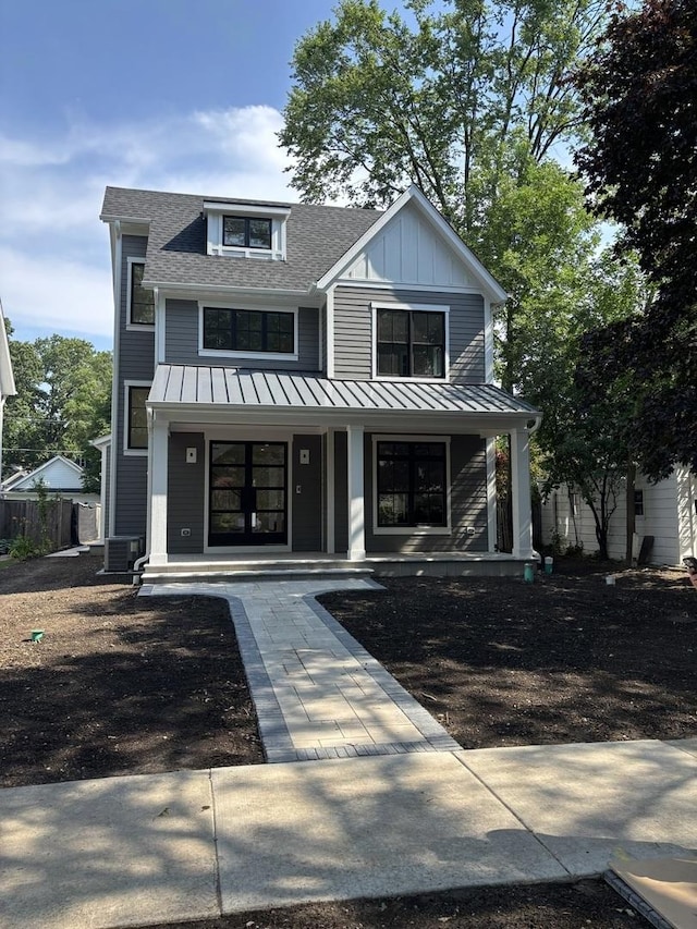 1206 Isabella St, Wilmette, IL 60091 - view of front of home featuring covered porch, a standing seam roof, roof with shingles, and a metal roof