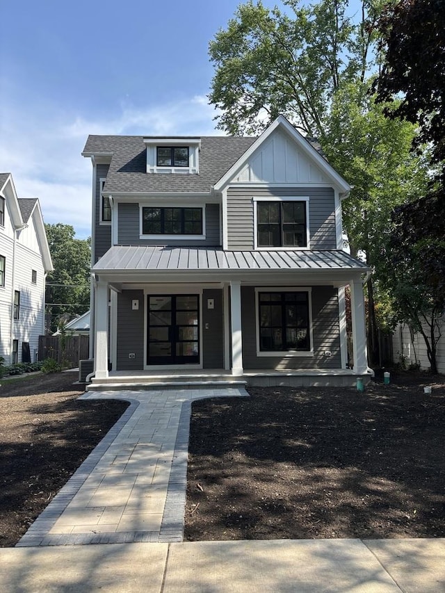 1206 Isabella St, Wilmette, IL 60091 - modern inspired farmhouse featuring a standing seam roof, a porch, and roof with shingles
