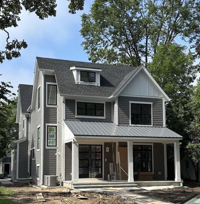 1206 Isabella St, Wilmette, IL 60091 - modern farmhouse style home featuring a porch, board and batten siding, roof with shingles, and a metal roof