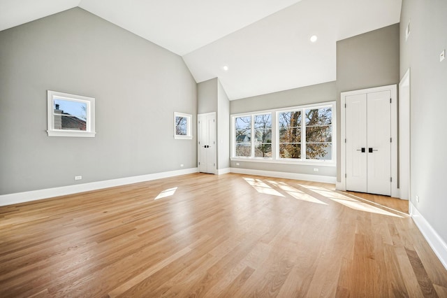 1206 Isabella St, Wilmette, IL 60091 - unfurnished living room with high vaulted ceiling and light wood finished floors