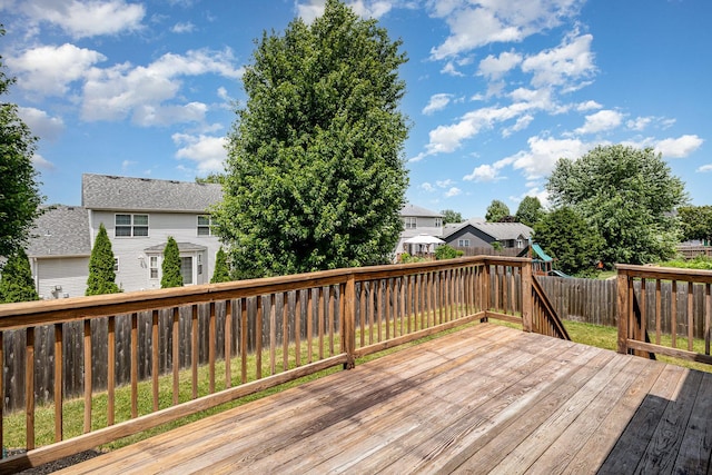 313 W Burlington Dr, Maple Park, IL 60151 - wooden terrace with a playground, a fenced backyard, and a residential view