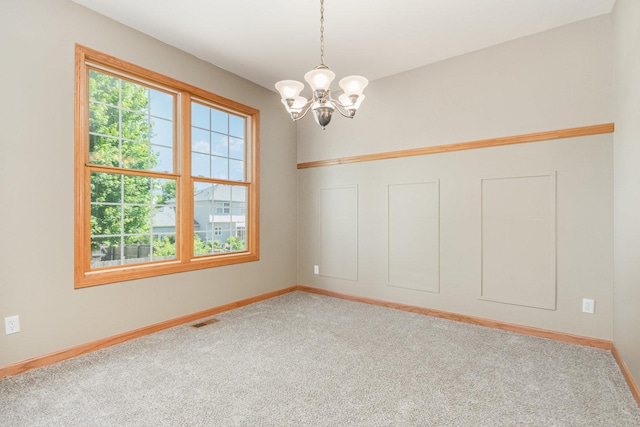 313 W Burlington Dr, Maple Park, IL 60151 - spare room with carpet flooring and a chandelier