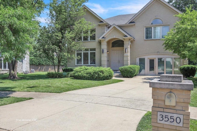 3550 E Ari Dr, Glenview, IL 60025 - view of front facade featuring brick siding and driveway