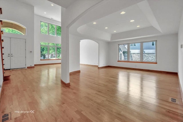 3550 E Ari Dr, Glenview, IL 60025 - entrance foyer featuring arched walkways, plenty of natural light, light wood-type flooring, a raised ceiling, and recessed lighting
