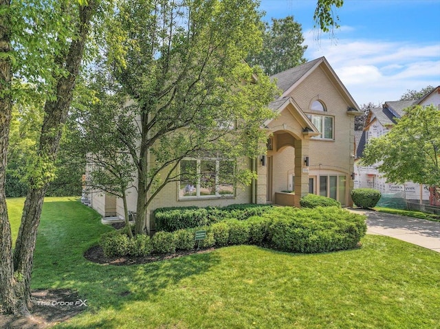 3550 E Ari Dr, Glenview, IL 60025 - view of front of house featuring brick siding and a front lawn
