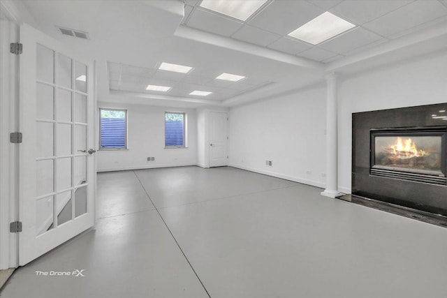 3550 E Ari Dr, Glenview, IL 60025 - empty room with a glass covered fireplace, a drop ceiling, and decorative columns