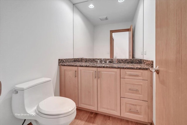 3550 E Ari Dr, Glenview, IL 60025 - half bathroom featuring vanity, wood finished floors, and recessed lighting