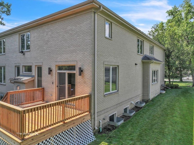 3550 E Ari Dr, Glenview, IL 60025 - rear view of house featuring a yard, brick siding, and a wooden deck