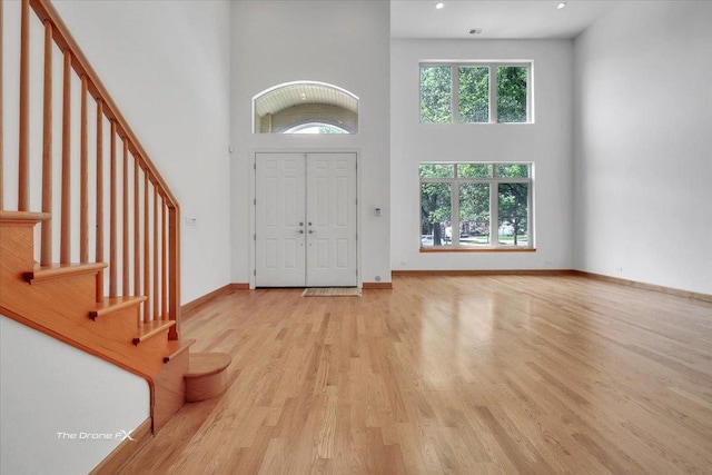 3550 E Ari Dr, Glenview, IL 60025 - foyer with a towering ceiling, stairway, wood finished floors, and recessed lighting