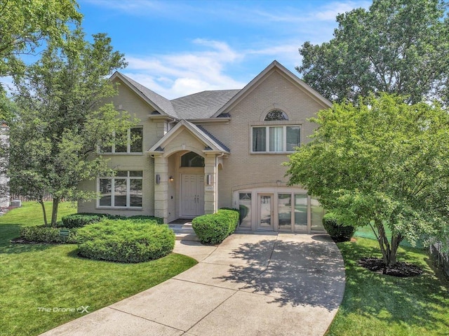 3550 E Ari Dr, Glenview, IL 60025 - view of front facade featuring a front yard and brick siding