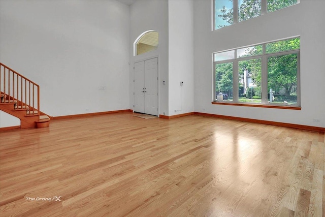 3550 E Ari Dr, Glenview, IL 60025 - foyer with a towering ceiling, wood finished floors, and stairs