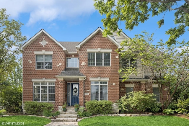 1000 S Madison Ave, La Grange, IL 60525 - view of front of house featuring brick siding, a front lawn, and roof with shingles