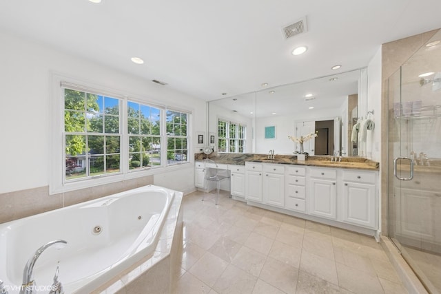 1000 S Madison Ave, La Grange, IL 60525 - full bath with double vanity, a tub with jets, a stall shower, tile patterned flooring, and recessed lighting
