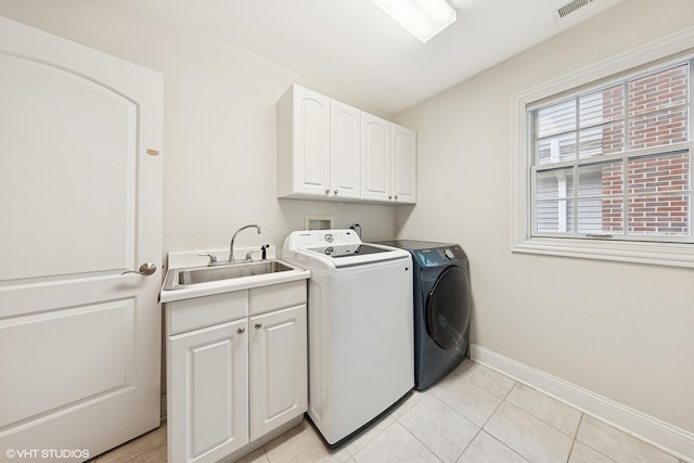 1000 S Madison Ave, La Grange, IL 60525 - laundry room with washer and dryer, cabinet space, and light tile patterned flooring