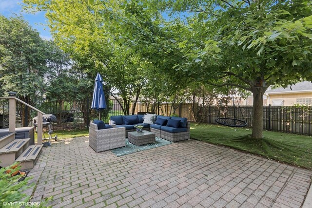 1000 S Madison Ave, La Grange, IL 60525 - fenced backyard with an outdoor hangout area, grilling area, and a patio area