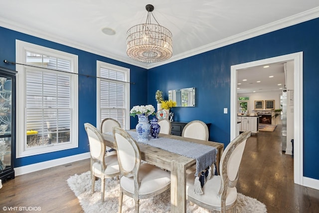 1000 S Madison Ave, La Grange, IL 60525 - dining space with a chandelier, dark wood-type flooring, and crown molding