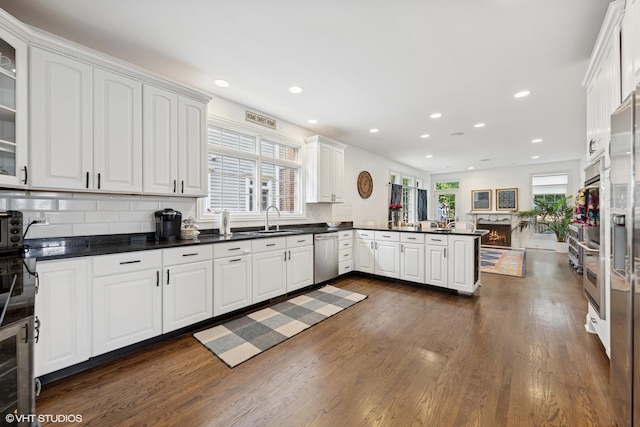 1000 S Madison Ave, La Grange, IL 60525 - kitchen featuring dishwasher, white cabinetry, dark wood-type flooring, a peninsula, and recessed lighting