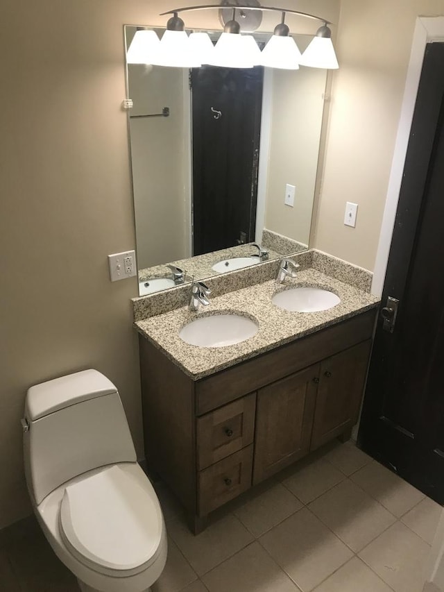 bathroom featuring tile patterned flooring and double vanity