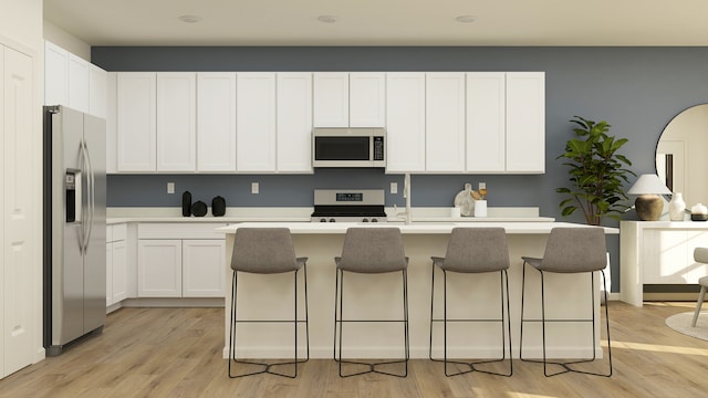 2909 Kelly Dr, Elgin, IL 60124 - kitchen with white appliances, light wood-type flooring, white cabinets, light countertops, and a kitchen breakfast bar