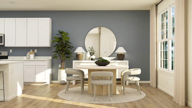2909 Kelly Dr, Elgin, IL 60124 - dining room with light wood-type flooring and baseboards