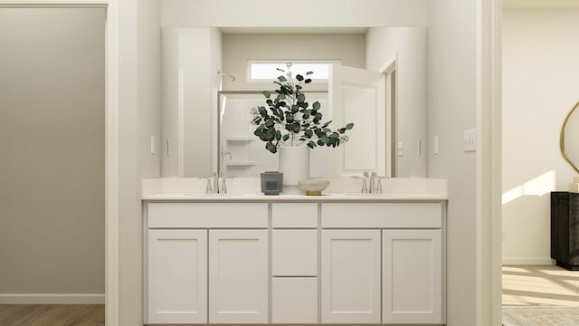 2909 Kelly Dr, Elgin, IL 60124 - bathroom featuring double vanity and baseboards
