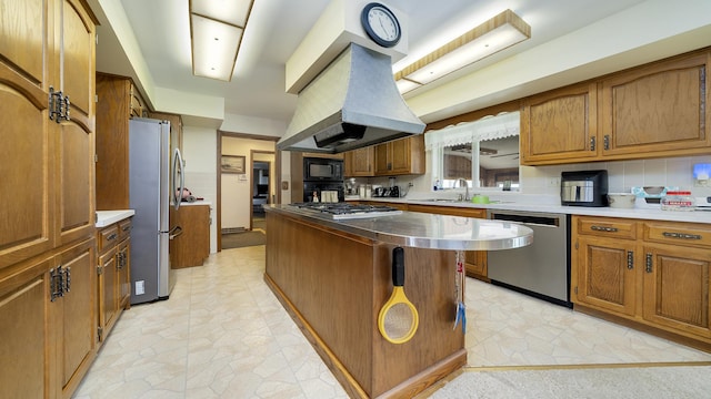 10245 W Penn Cor, Polo, IL 61064 - kitchen featuring appliances with stainless steel finishes, brown cabinetry, island range hood, a kitchen island, and light countertops